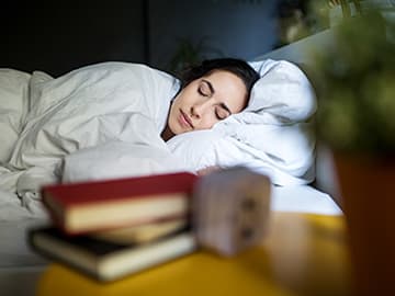 Lady sleeping well in bed