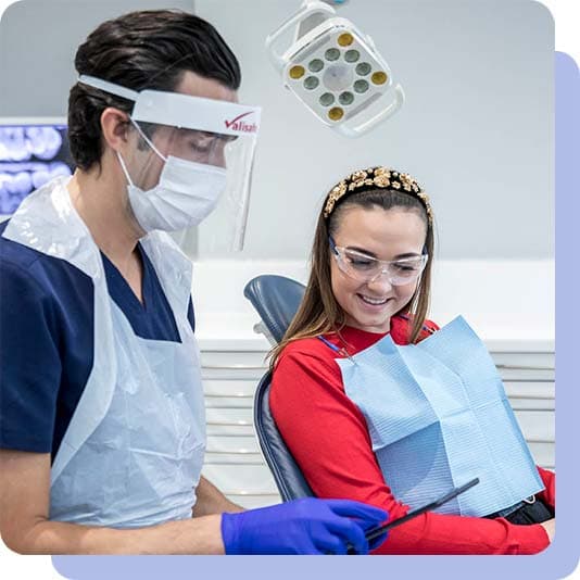 Patient and dentist looking at a iPad