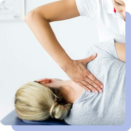 Woman receiving chiropractic treatment from a chiropractor